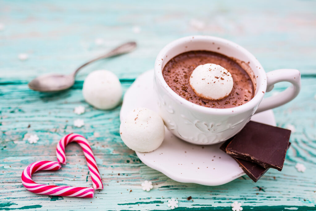 Rich Hot Chocolate with Marshmallows on Wooden Table